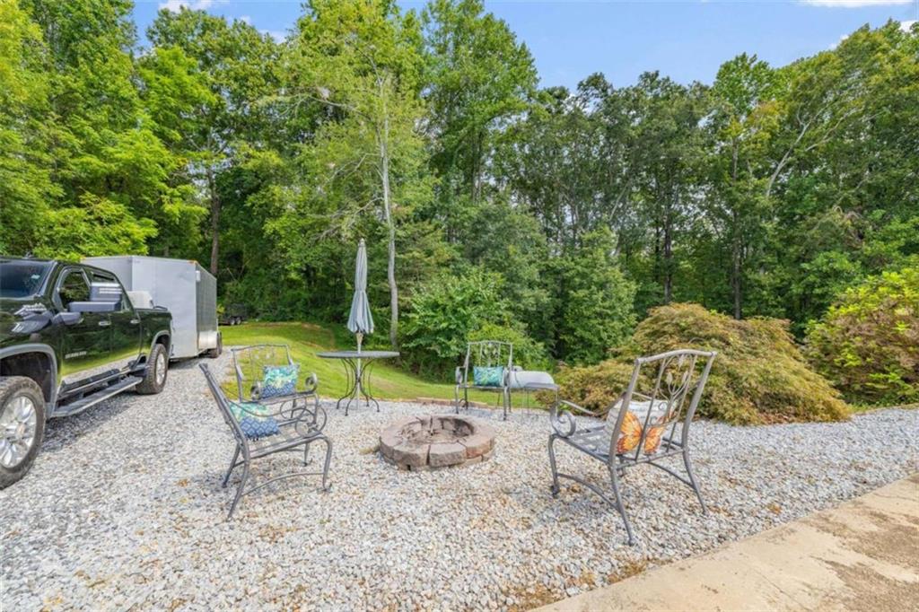 131 Caudell Drive Lula, GA 30554 - Photo 48 of 58 a view of a chairs and table in backyard