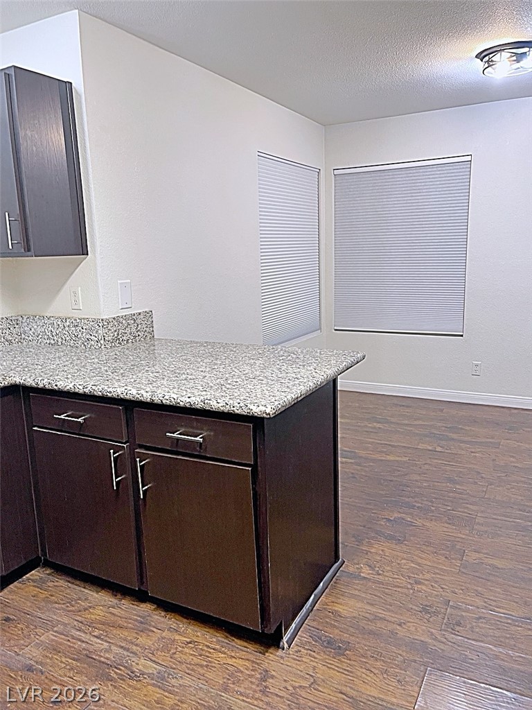 2200 South Fort Apache Road, Unit 2201 Las Vegas, NV 89117 - Photo 13 of 33 This spacious kitchen offers ample counter space and warm flooring, perfect for culinary endeavors.