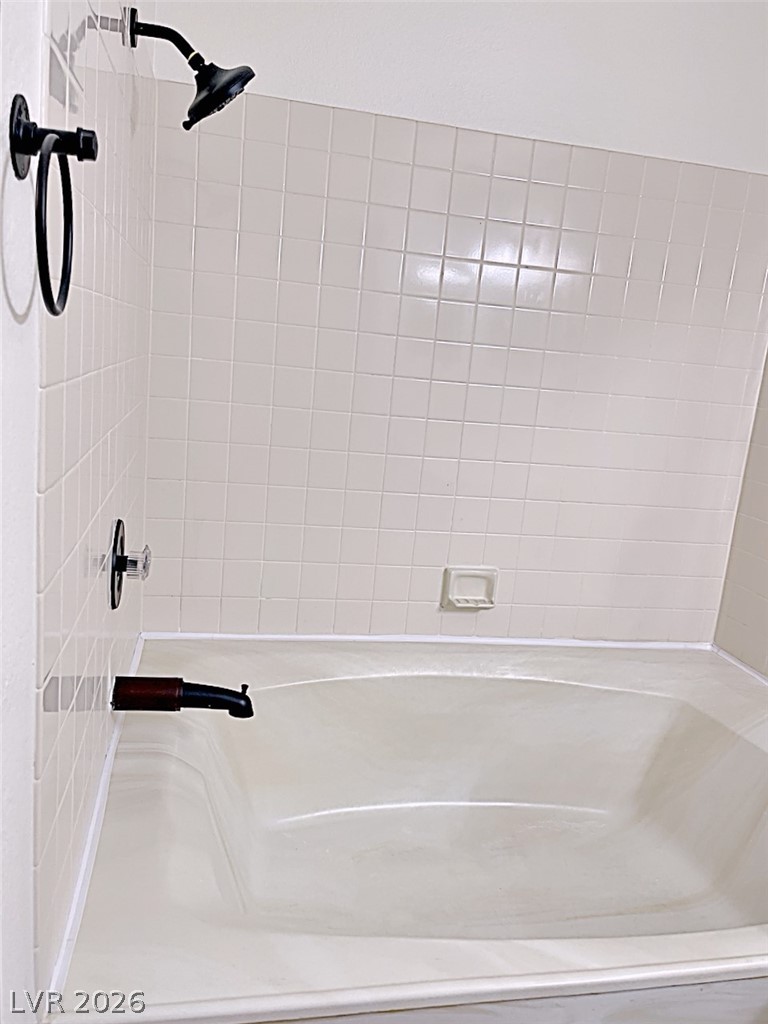 2200 South Fort Apache Road, Unit 2201 Las Vegas, NV 89117 - Photo 22 of 33 Relax and unwind in this serene bathroom, complete with a classic tub and shower.