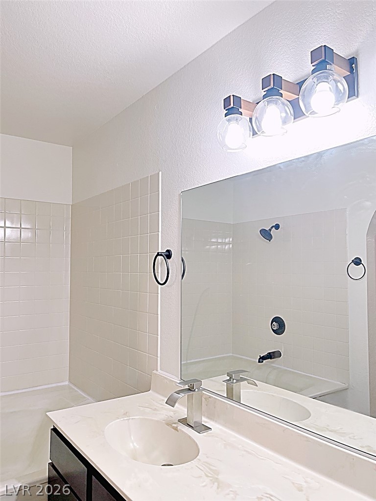 2200 South Fort Apache Road, Unit 2201 Las Vegas, NV 89117 - Photo 25 of 33 This bright bathroom features a spacious vanity with an integrated sink.