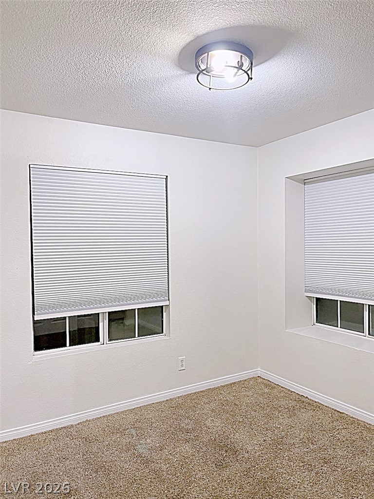 2200 South Fort Apache Road, Unit 2201 Las Vegas, NV 89117 - Photo 30 of 33 This spacious room features ample natural light and a neutral palette, offering a serene living space.