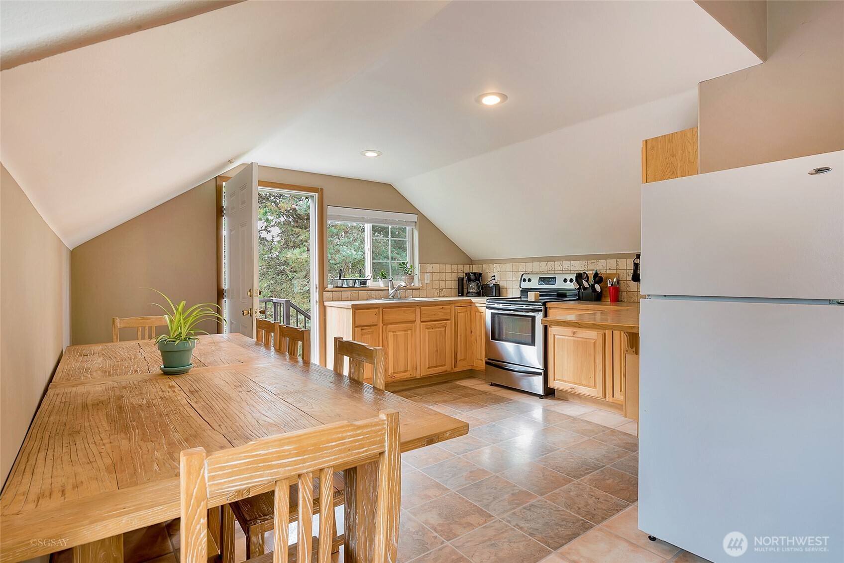 8138 Percie Road Custer, WA 98240 - Photo 35 of 40 a kitchen with sink refrigerator and large window