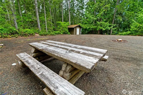 a view of a backyard with chairs