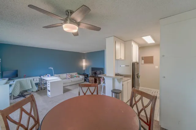 a kitchen with stainless steel appliances a stove a sink and cabinets