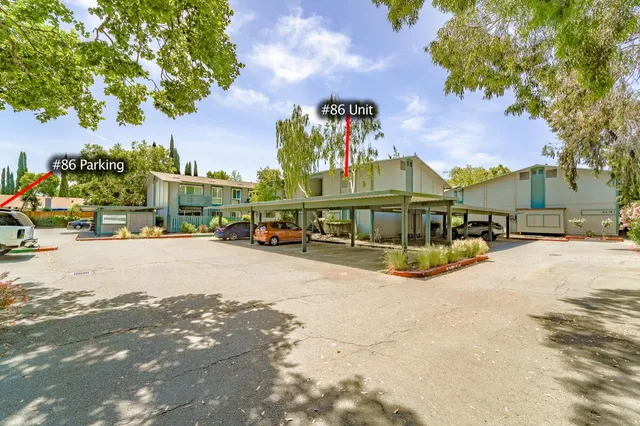 a view of a hallway with dining room and chair