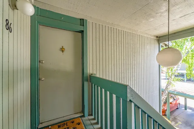 a view of kitchen with refrigerator cabinets and outdoor space