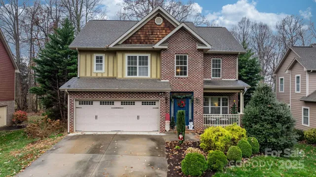 a front view of a house with a garden and plants