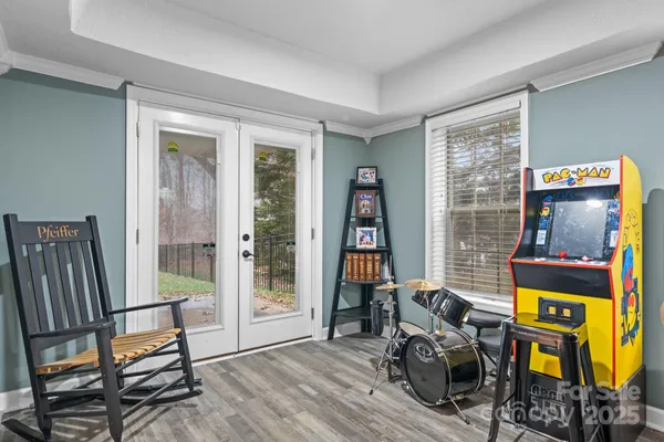 a view of a workspace with furniture and a window