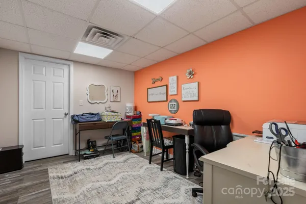 a view of a workspace with furniture