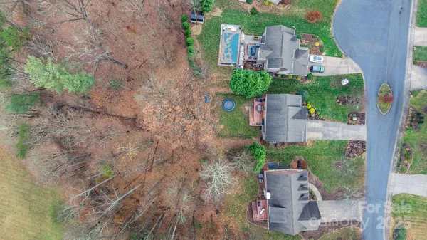 an aerial view of a house with outdoor space and street view