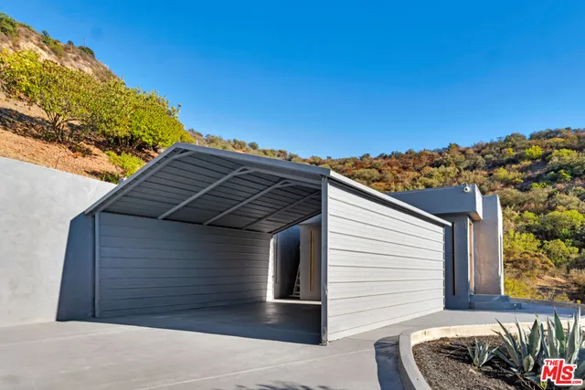 a view of a chairs and table in the patio