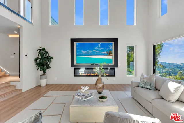 a kitchen with stainless steel appliances a sink stove and cabinets