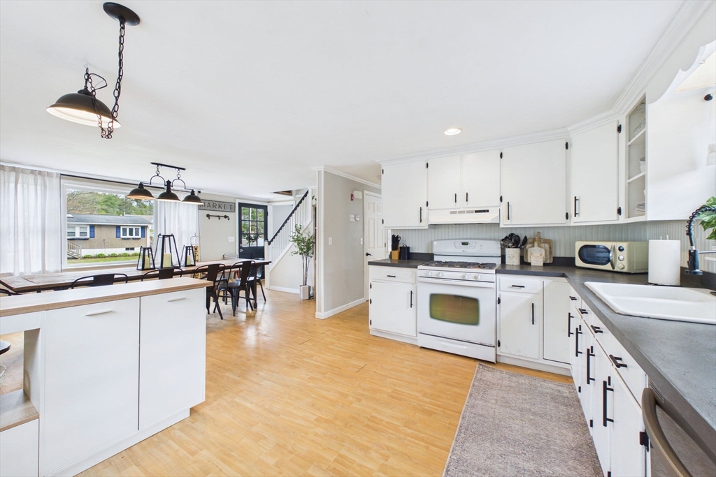 13 Albatross Avenue Wareham, MA 02538 - Photo 10 of 25 a kitchen with a white cabinets and white appliances