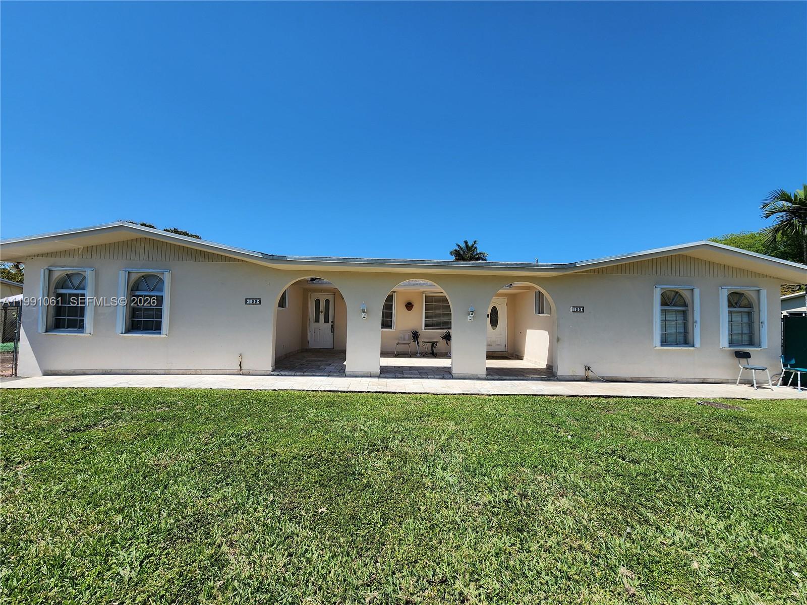 120 Southwest 80th Avenue Miami, FL 33144 - Photo 2 of 10 a front view of a house with a yard