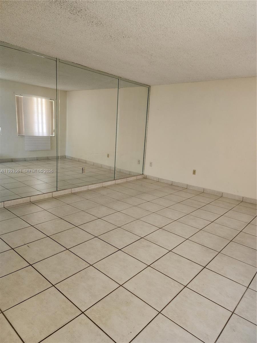120 Southwest 80th Avenue Miami, FL 33144 - Photo 4 of 10 a view of an empty room and window