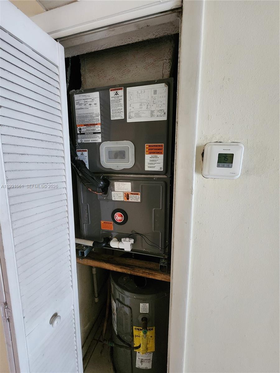 120 Southwest 80th Avenue Miami, FL 33144 - Photo 8 of 10 a room with a stove and a microwave