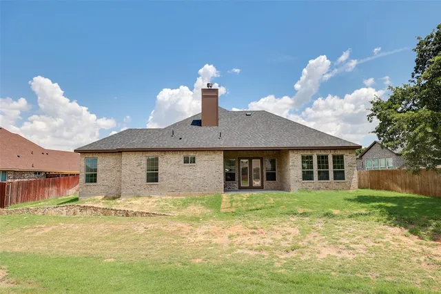 a house view with a swimming pool and garden