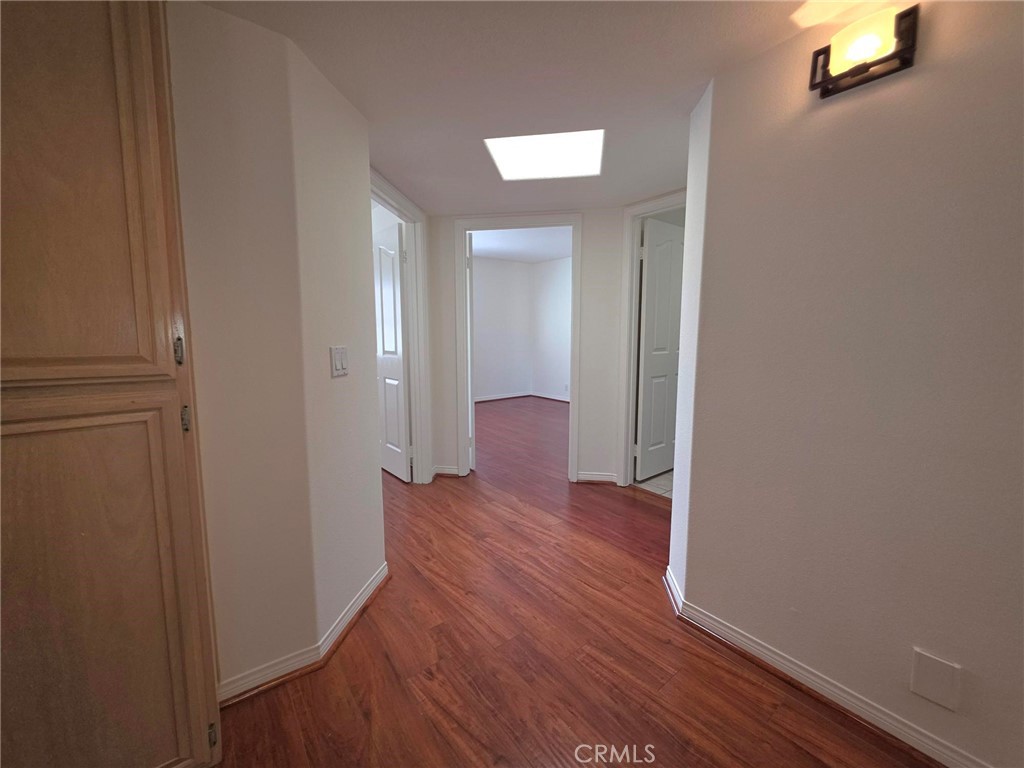 5340 Las Virgenes Road, Unit 1 Calabasas, CA 91302 - Photo 14 of 23 a view of a hallway with wooden floor