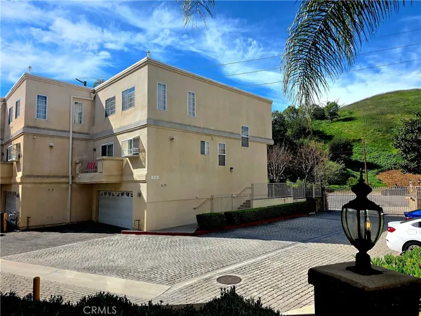 a front view of a house with yard