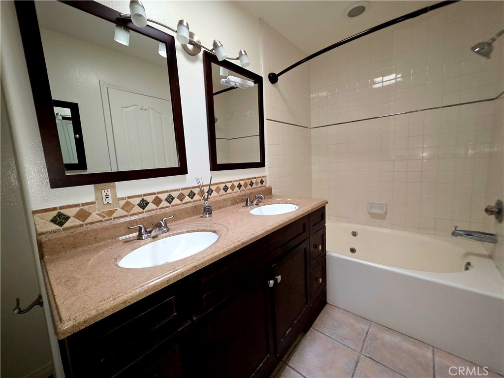 5340 Las Virgenes Road, Unit 1 Calabasas, CA 91302 - Photo 5 of 23 a bathroom with a granite countertop sink double vanity and a mirror