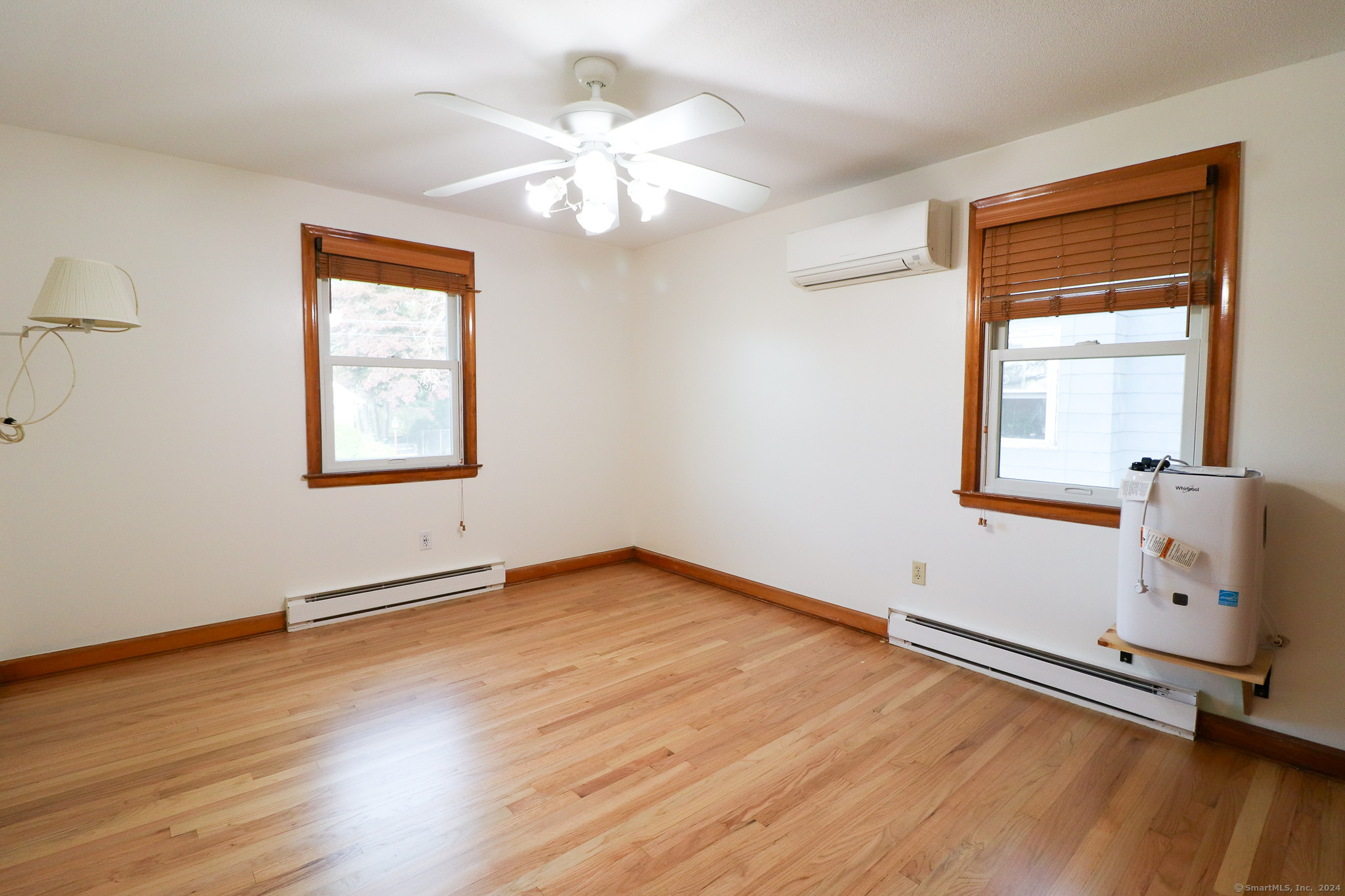 63 Home Avenue Meriden, CT 06451 - Photo 12 of 26 a view of an empty room with a window and wooden floor