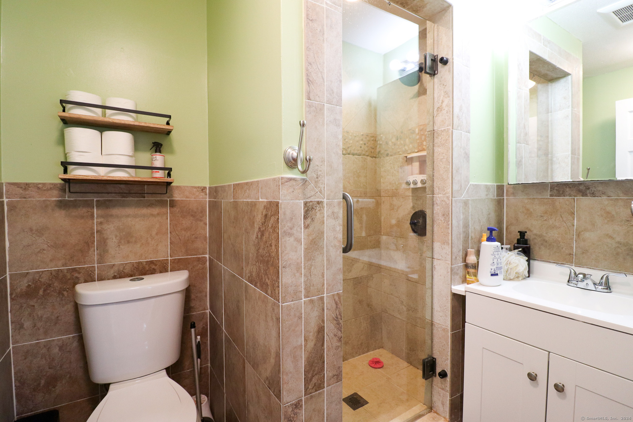 63 Home Avenue Meriden, CT 06451 - Photo 14 of 26 a bathroom with a sink toilet and shower