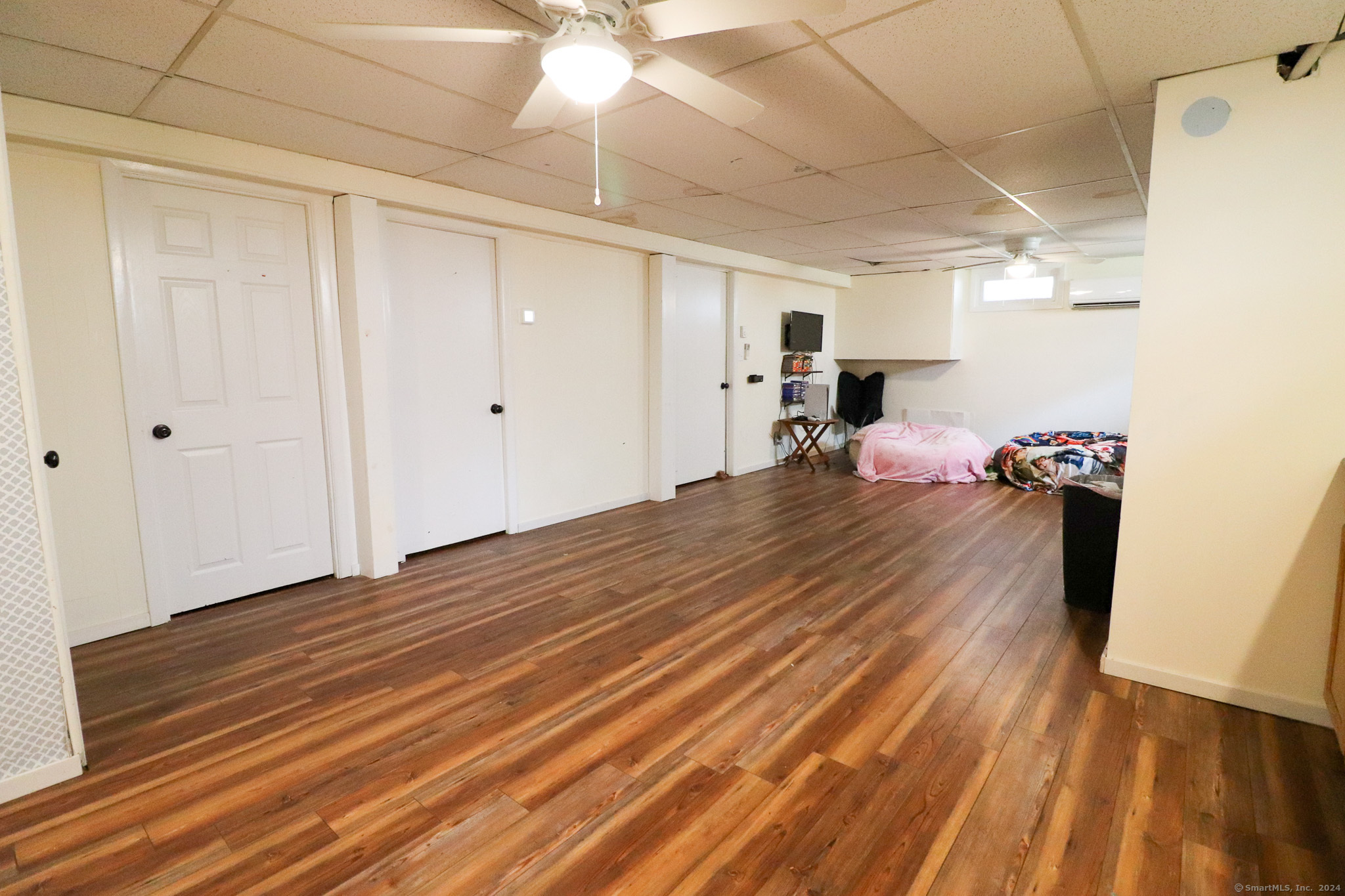 63 Home Avenue Meriden, CT 06451 - Photo 18 of 26 a room with wooden floor and natural light