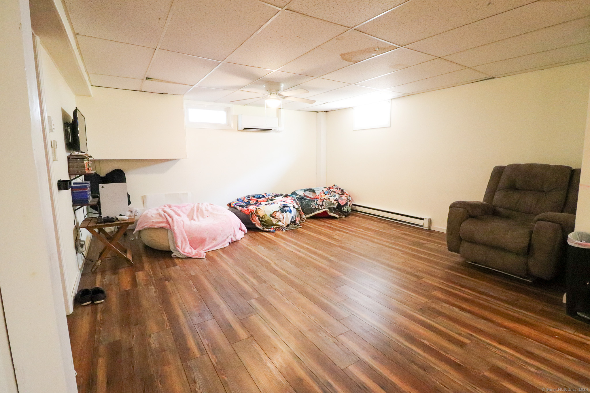 63 Home Avenue Meriden, CT 06451 - Photo 20 of 26 a bedroom with furniture and a wooden floor