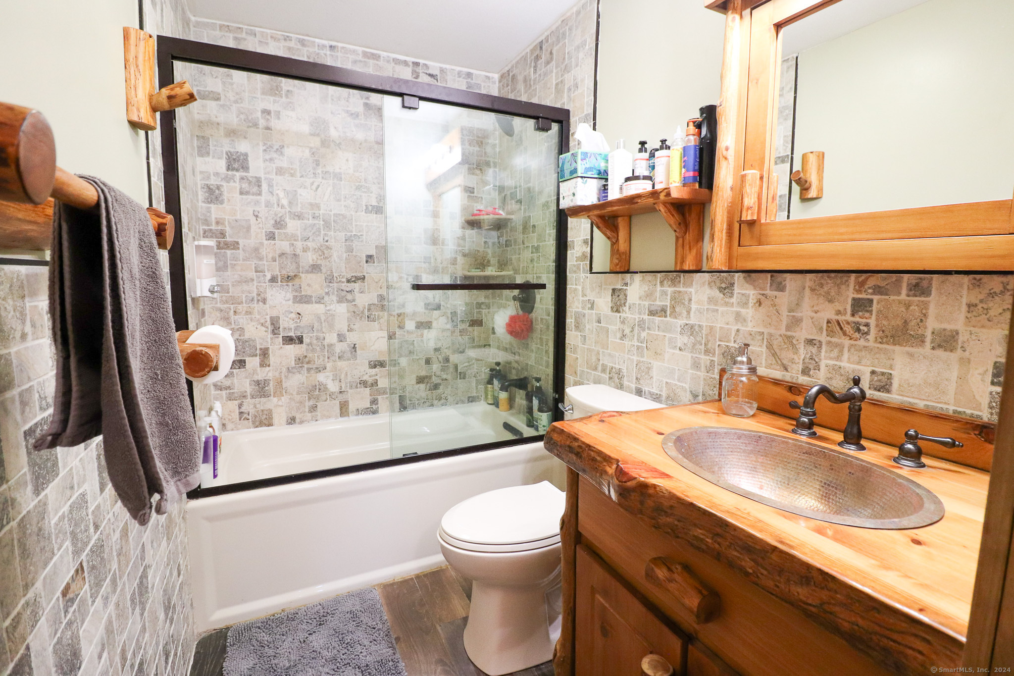 63 Home Avenue Meriden, CT 06451 - Photo 7 of 26 a bathroom with a sink a toilet and shower