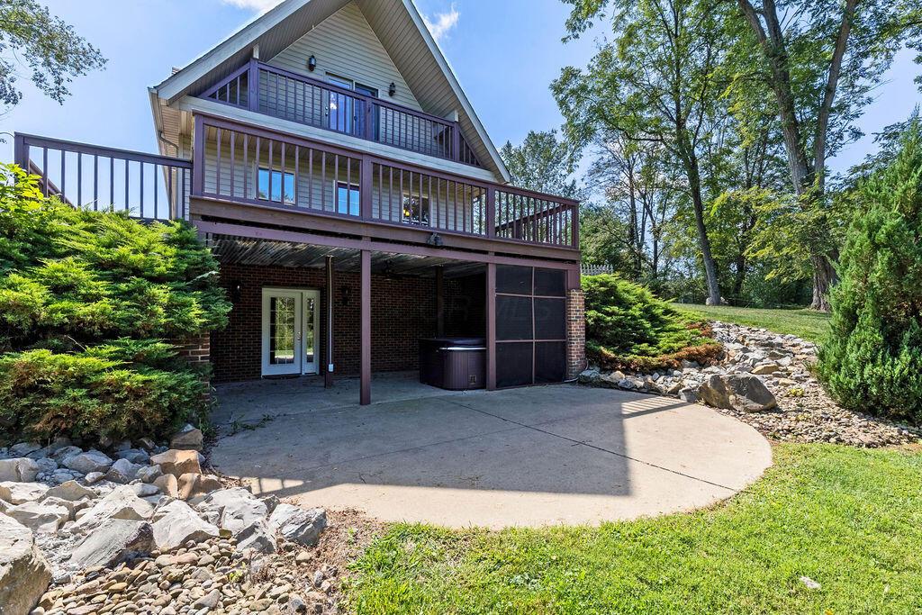 2085 George Road Zanesville, OH 43701 - Photo 7 of 72 view showing walkout patio from LL & main floor deck from the rear