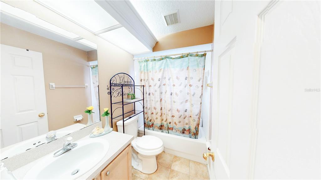 1103 Mallory Point Drive Valrico, FL 33596 - Photo 4 of 21 a bathroom with a sink toilet and shower