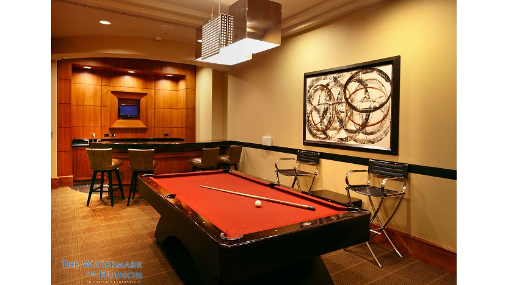 8100 River Road, Unit 1203 North Bergen, NJ 07047 - Photo 20 of 31 a room with table tennis air hockey table and paintings on the wall