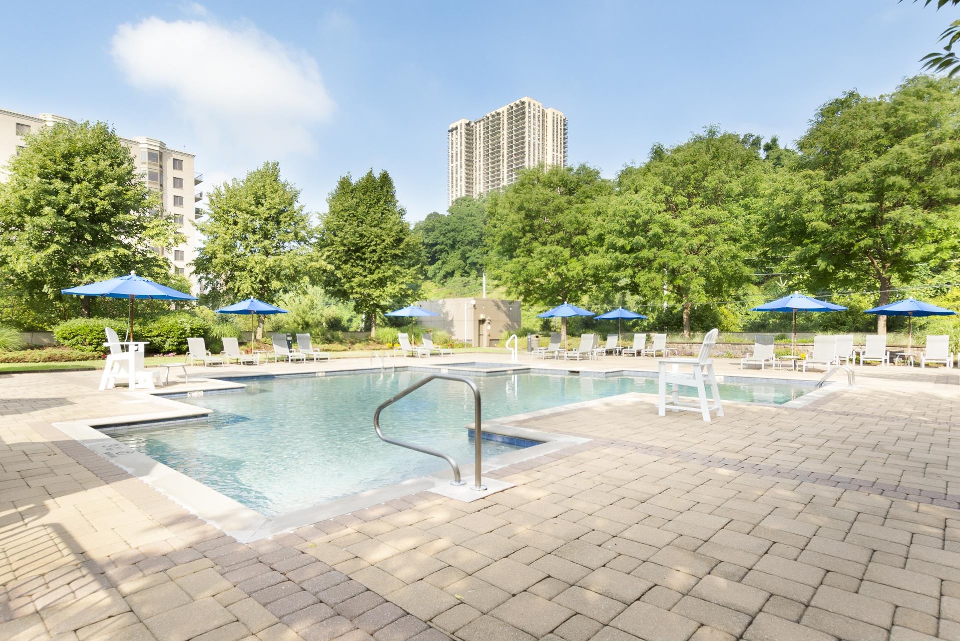 8100 River Road, Unit 1203 North Bergen, NJ 07047 - Photo 21 of 31 a view of swimming pool with outdoor seating and plants
