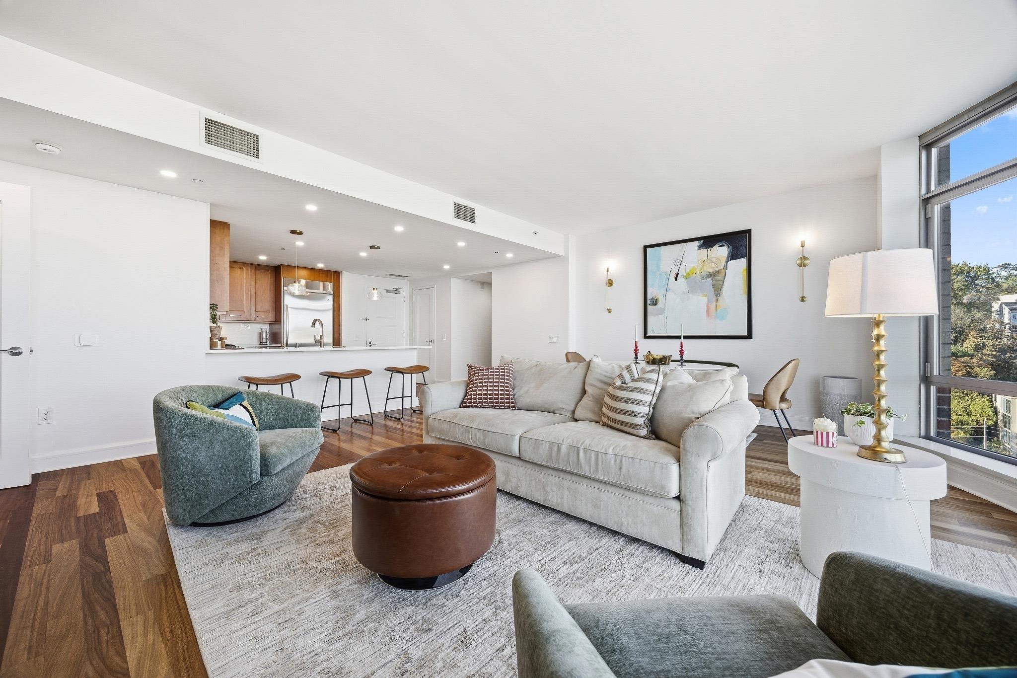 8100 River Road, Unit 1203 North Bergen, NJ 07047 - Photo 4 of 31 a living room with furniture and a lamp