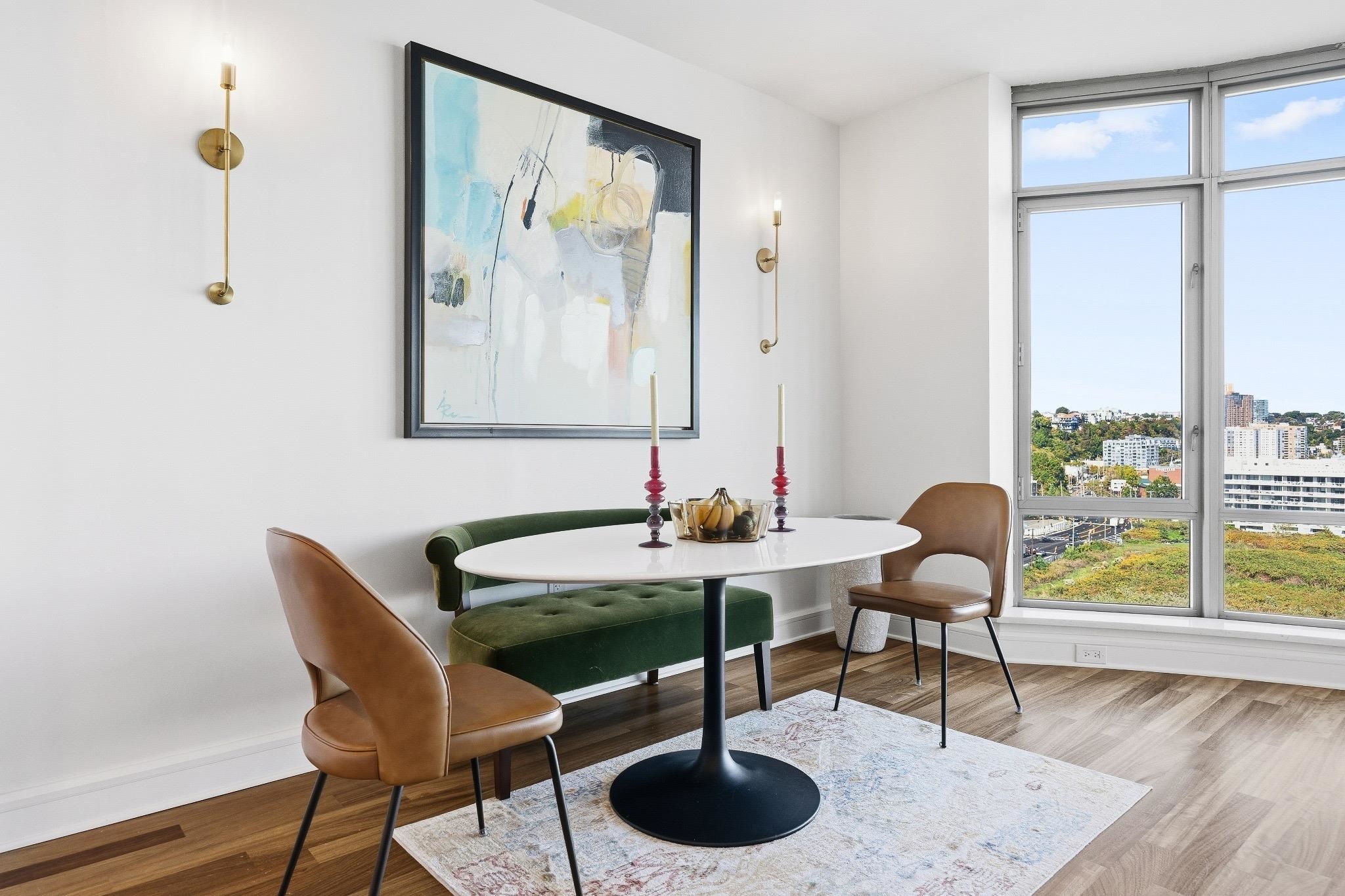 8100 River Road, Unit 1203 North Bergen, NJ 07047 - Photo 6 of 31 a dining room with furniture and a floor to ceiling window