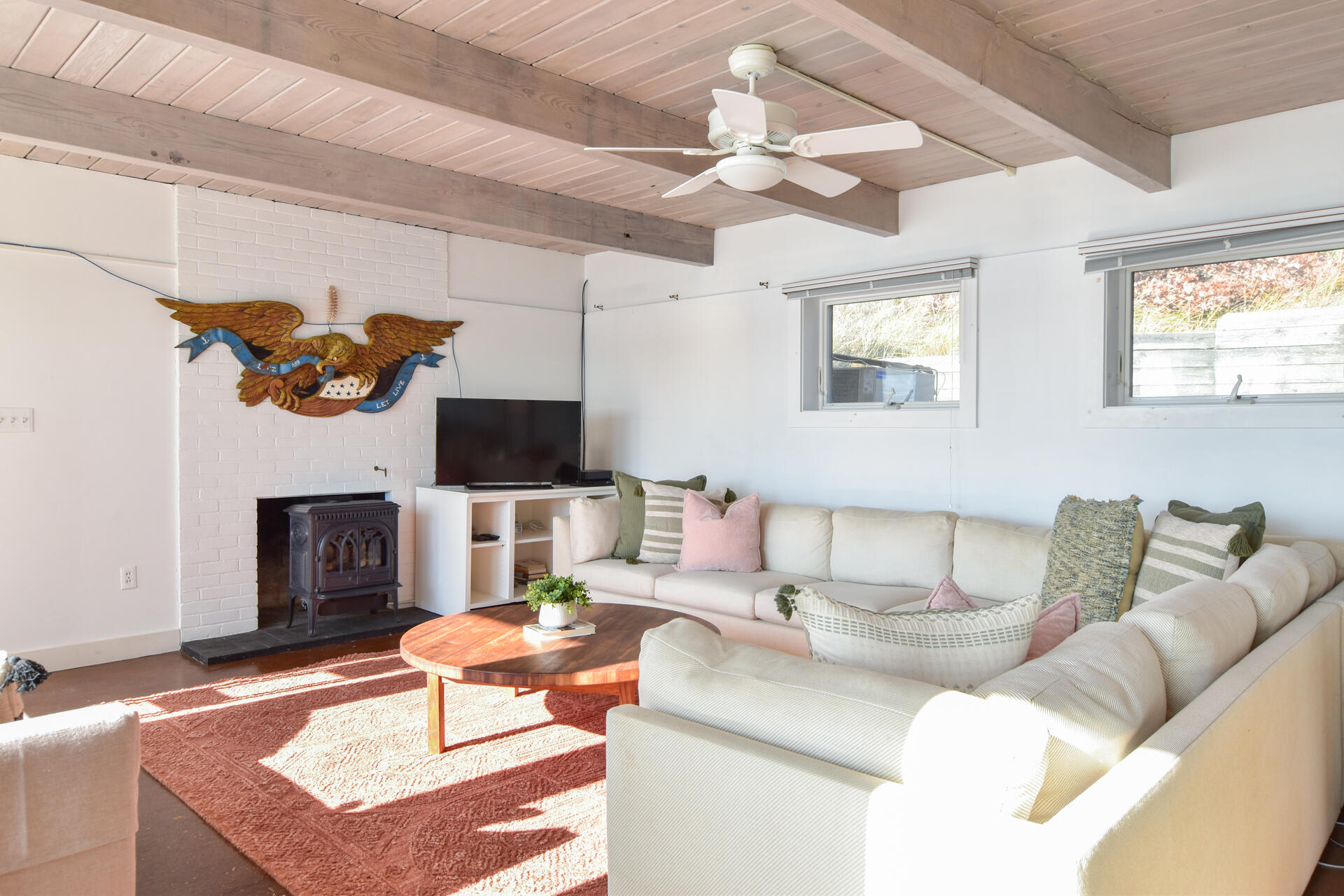 945 Chequessett Neck Road Wellfleet, MA 02667 - Photo 16 of 57 a living room with furniture and a flat screen tv