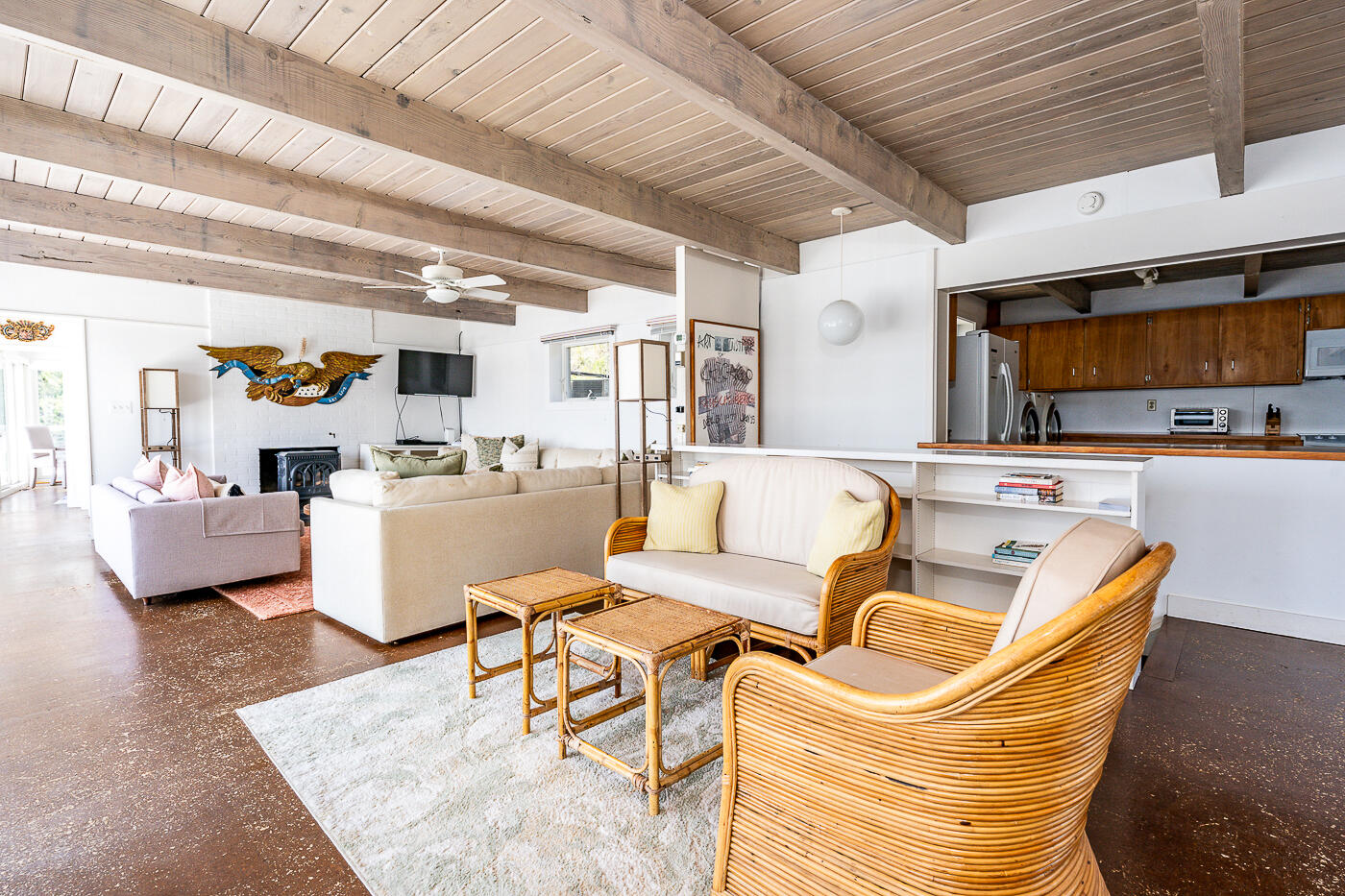 945 Chequessett Neck Road Wellfleet, MA 02667 - Photo 17 of 57 a living room with furniture kitchen view and a chandelier