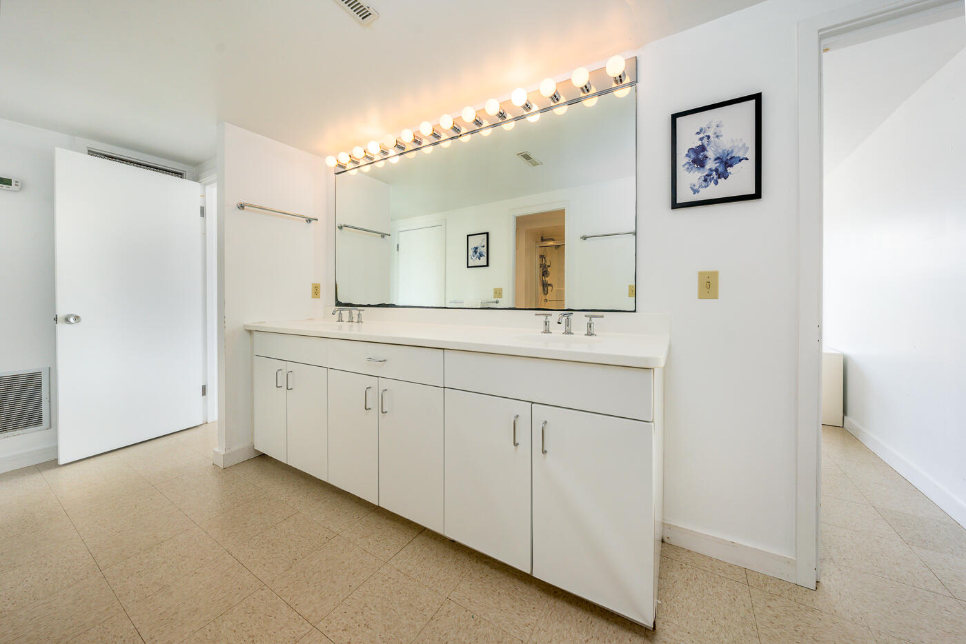 945 Chequessett Neck Road Wellfleet, MA 02667 - Photo 30 of 57 a bathroom with a sink a mirror and a vanity