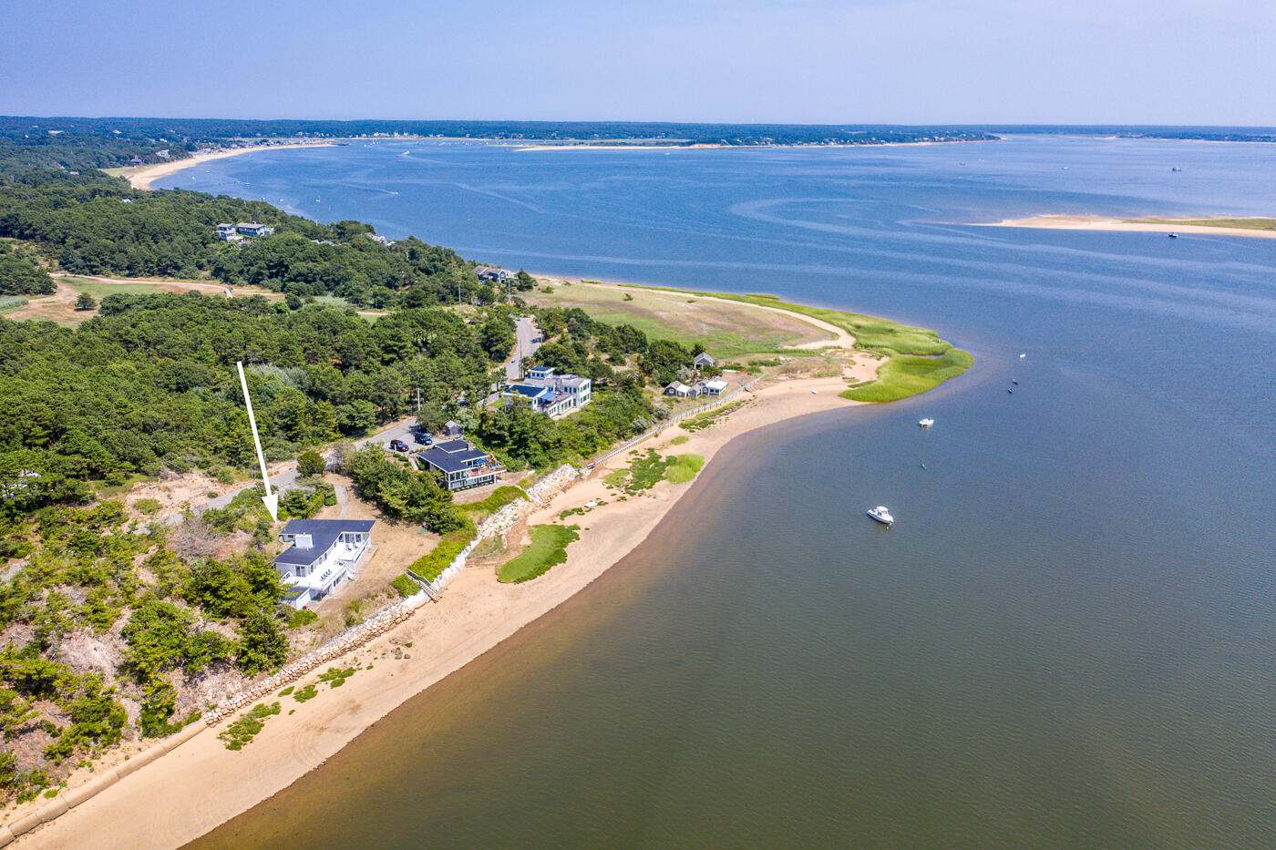 945 Chequessett Neck Road Wellfleet, MA 02667 - Photo 3 of 57 a view of a lake from a balcony