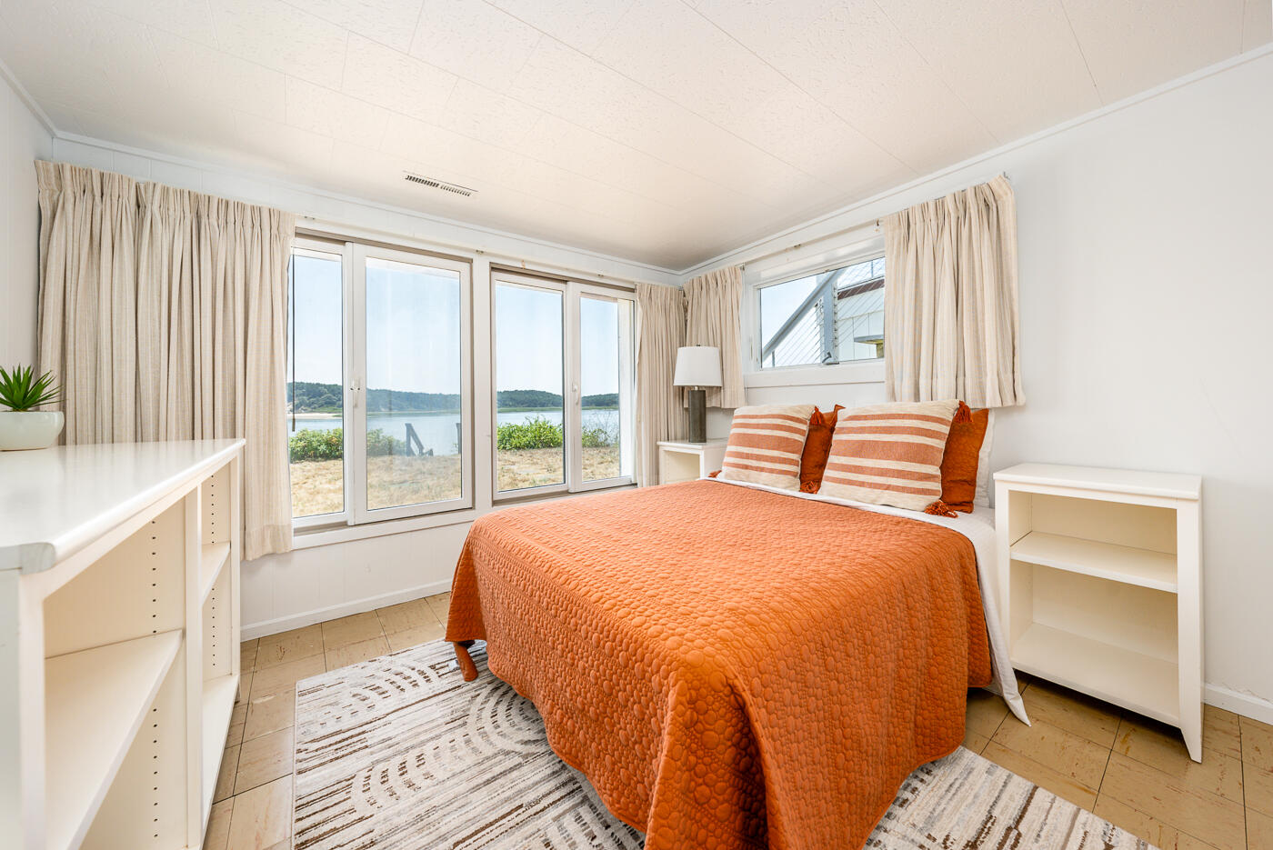 945 Chequessett Neck Road Wellfleet, MA 02667 - Photo 32 of 57 a bedroom with a bed and a window