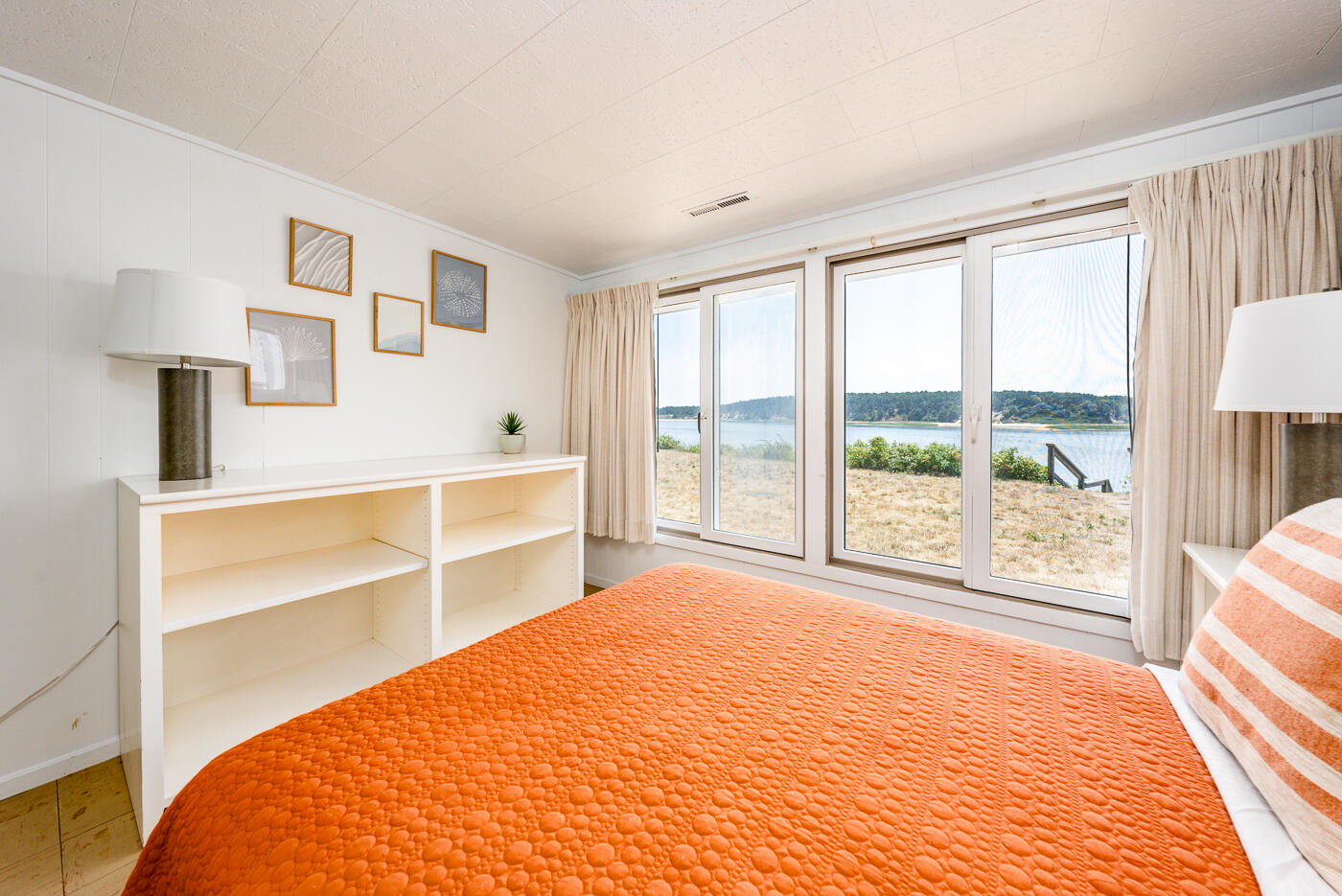 945 Chequessett Neck Road Wellfleet, MA 02667 - Photo 33 of 57 a bedroom with a bed and a large window