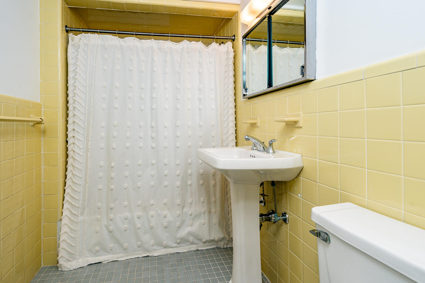945 Chequessett Neck Road Wellfleet, MA 02667 - Photo 34 of 57 a bathroom with a sink a toilet and shower
