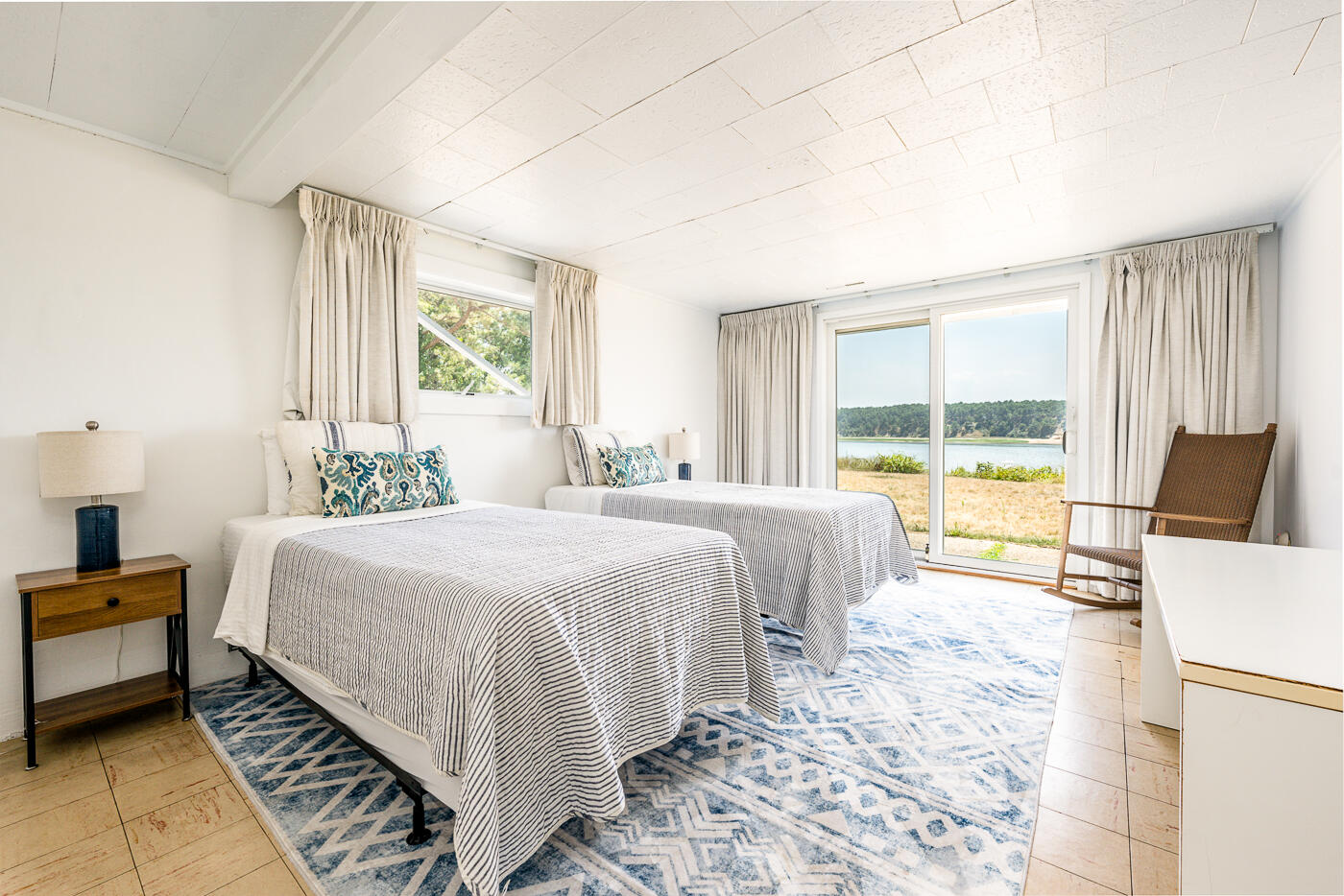 945 Chequessett Neck Road Wellfleet, MA 02667 - Photo 35 of 57 a bedroom with a bed and wooden floor