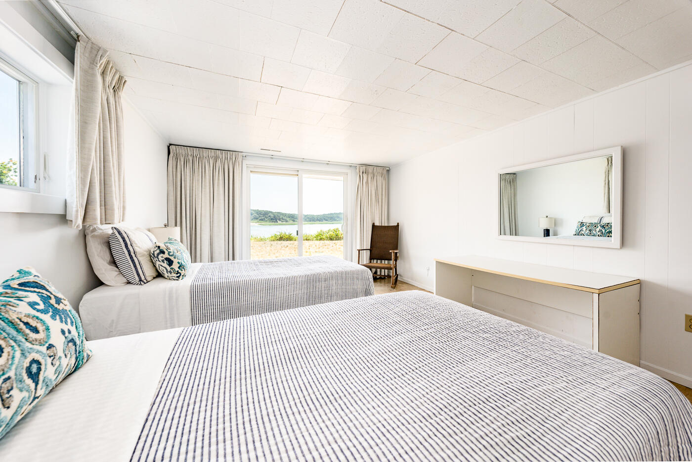 945 Chequessett Neck Road Wellfleet, MA 02667 - Photo 36 of 57 a bedroom with a large bed and a window