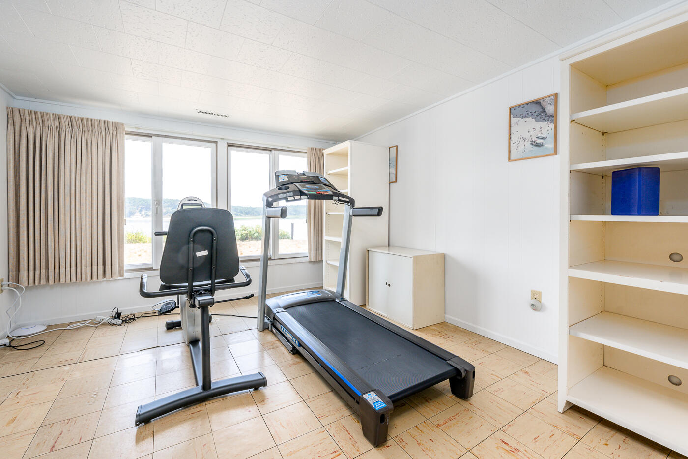 945 Chequessett Neck Road Wellfleet, MA 02667 - Photo 38 of 57 a room with gym equipment and a window