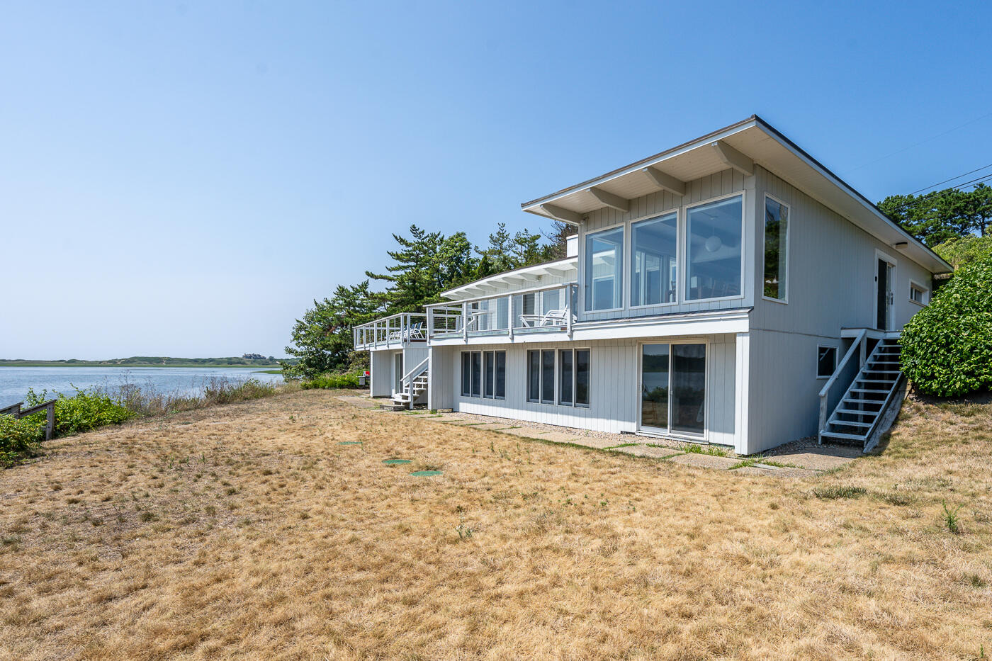 945 Chequessett Neck Road Wellfleet, MA 02667 - Photo 39 of 57 a front view of house with yard