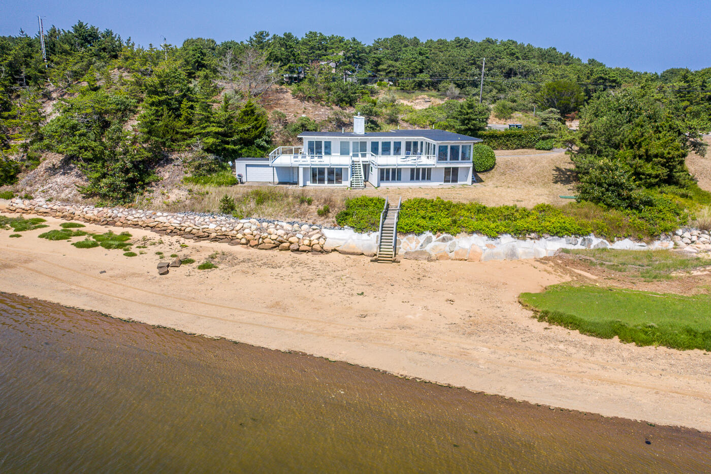 945 Chequessett Neck Road Wellfleet, MA 02667 - Photo 4 of 57 a view of a house with a yard and a large tree