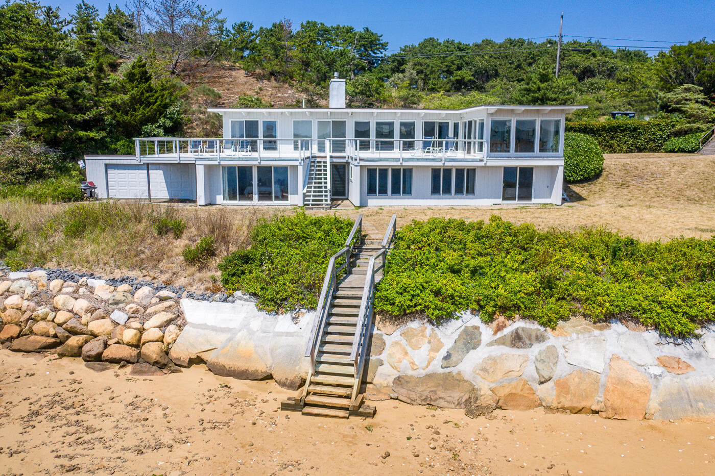 945 Chequessett Neck Road Wellfleet, MA 02667 - Photo 47 of 57 a front view of a house with a yard
