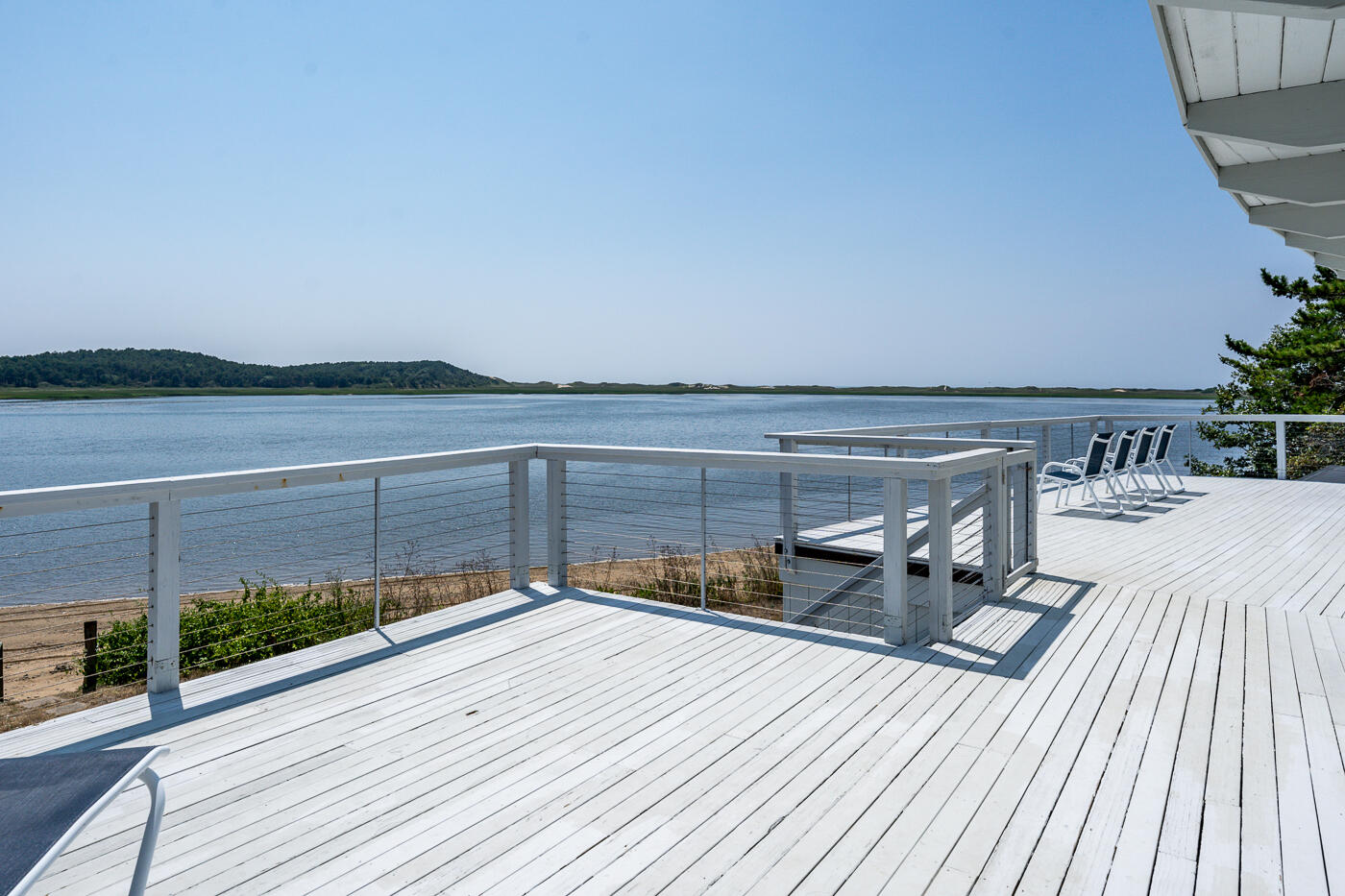945 Chequessett Neck Road Wellfleet, MA 02667 - Photo 52 of 57 a view of a terrace with a bench
