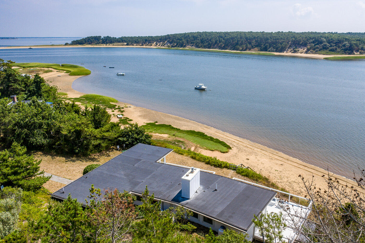 945 Chequessett Neck Road Wellfleet, MA 02667 - Photo 55 of 57 an aerial view of a house with a lake view